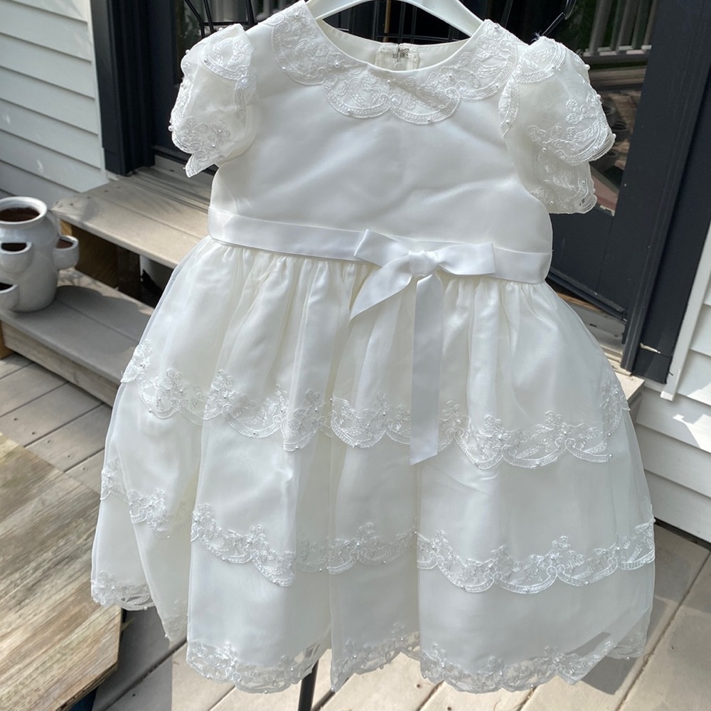 Detail, this dress has it all, sleeves,neck and I’m the skirt, satin bow.